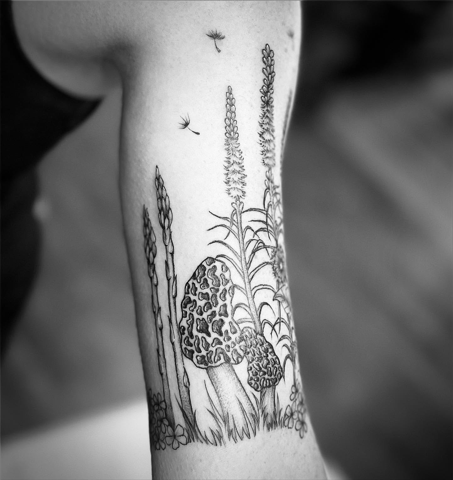 Mushroom and plants realism tattoo on the forearm by Rikki