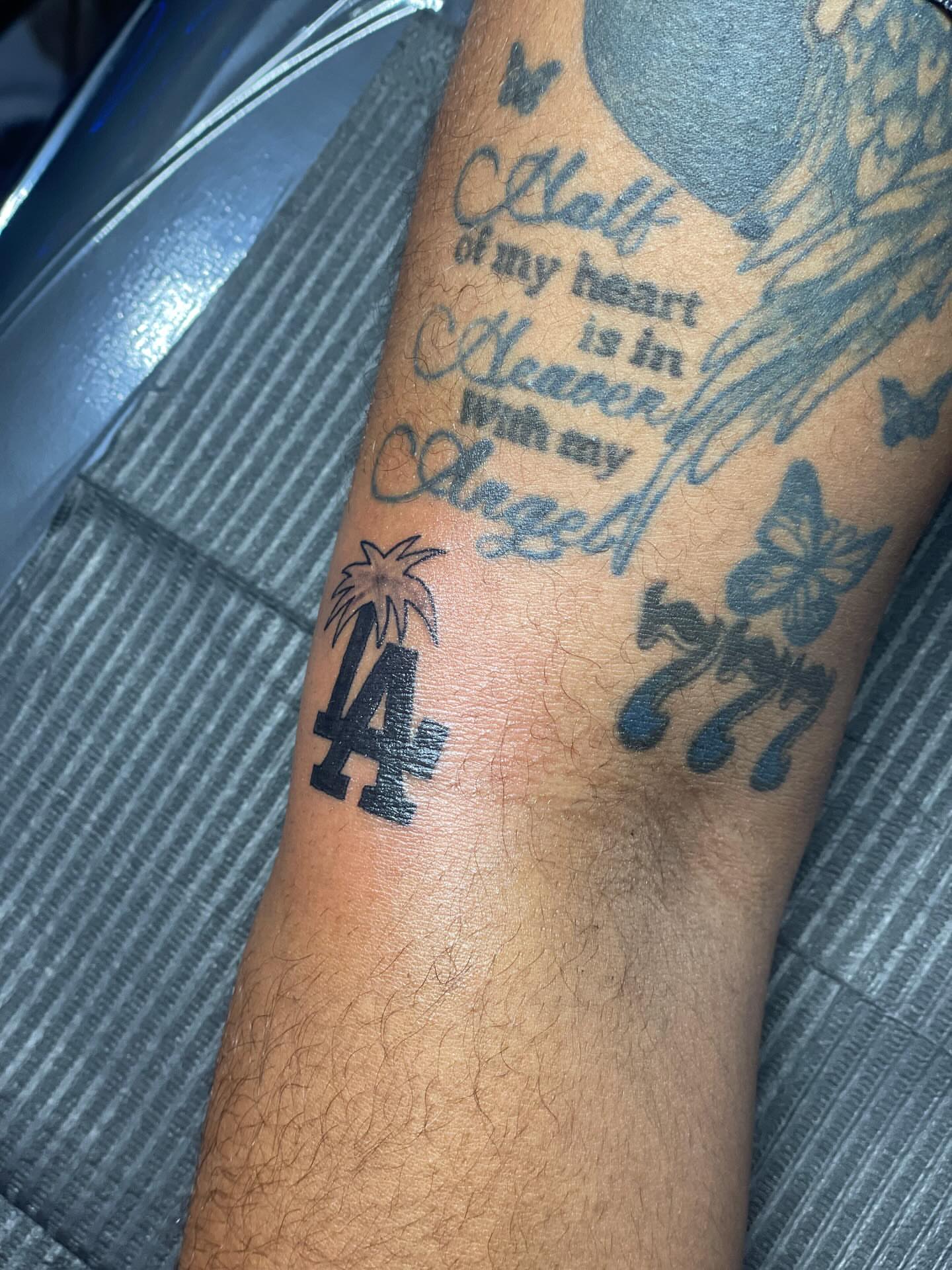 Angel and heart black and grey tattoo on the forearm by 😈headhuncho😈