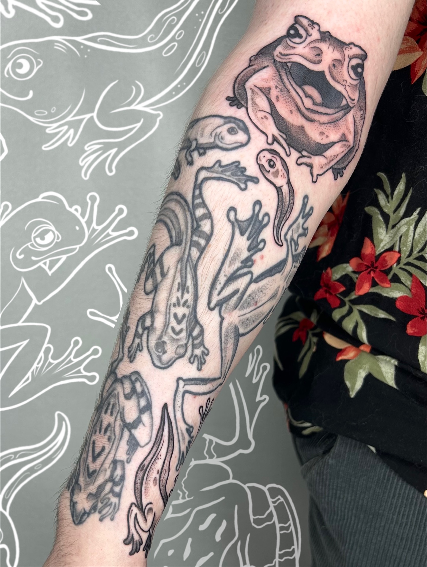 Frogs black and grey tattoo on the forearm by Aaron Murray ✨ Michigan Tattoo Artist