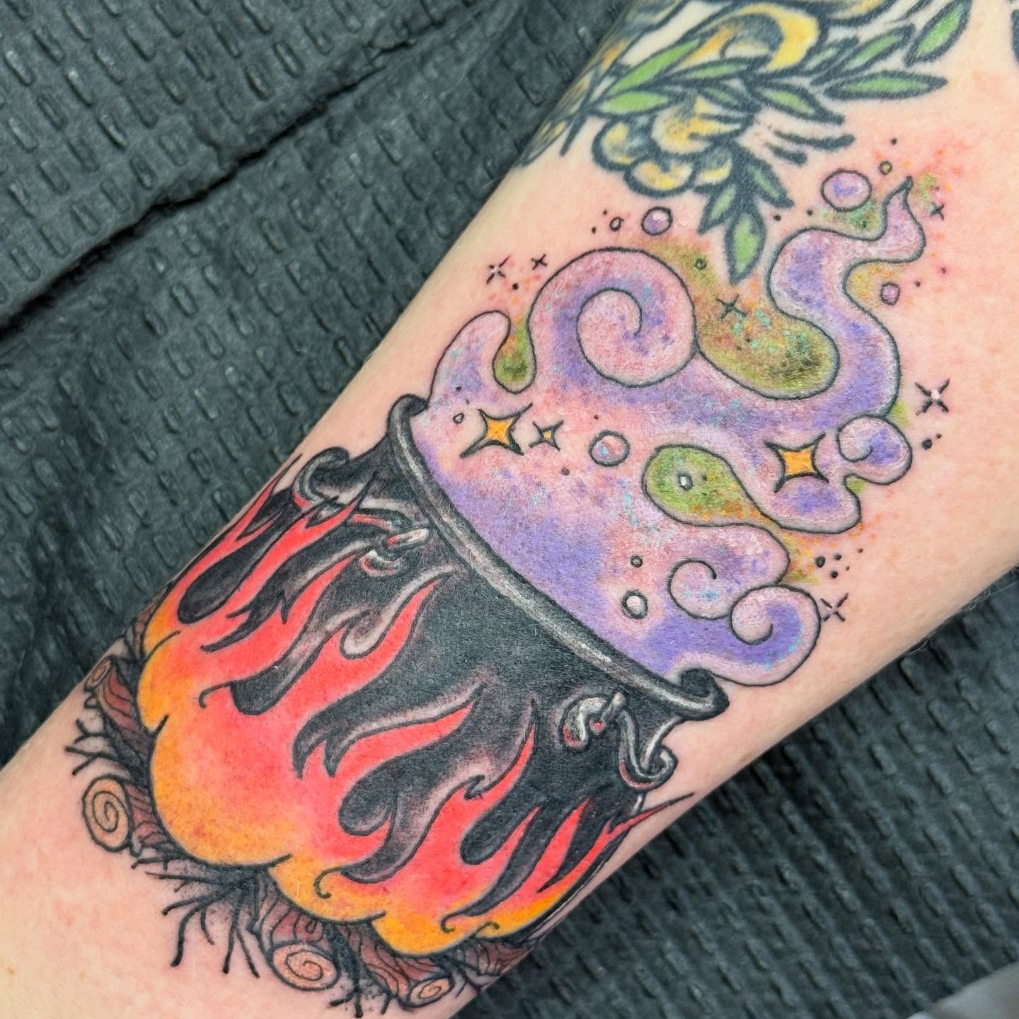 Flame and cloud new school tattoo on the forearm by Tattoos By Trish