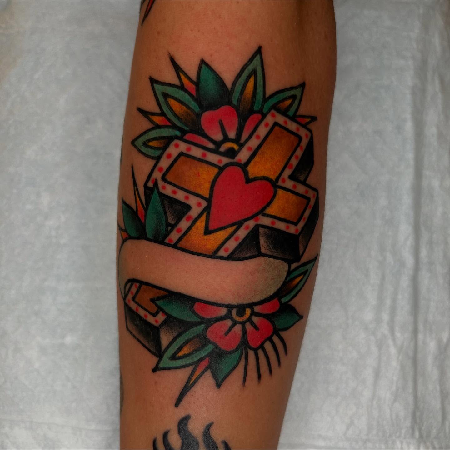 Boxed heart American traditional tattoo on the forearm by Atom Aker