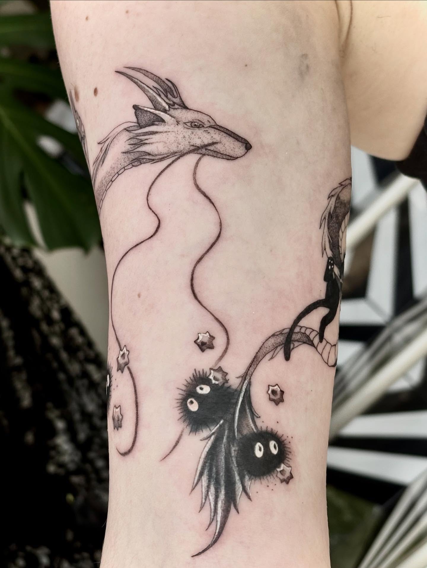 Japanese dragon and kiki's delivery service characters dotwork tattoo on the forearm by Jazzlyn Hous