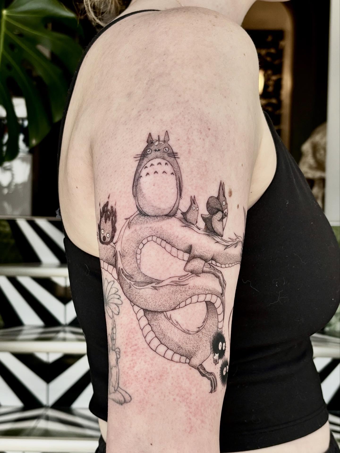 Totoro and friends realism tattoo on the upper arm by Jazzlyn Hous