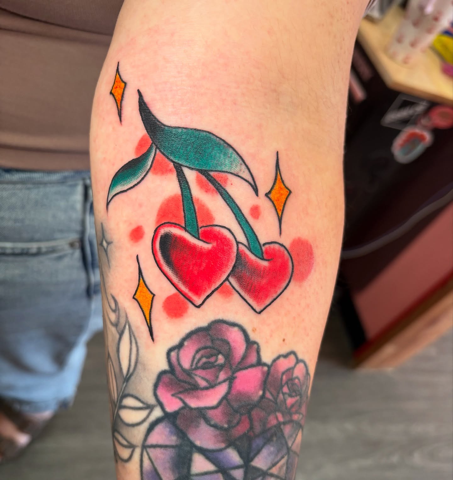 Cherries and roses American traditional tattoo on the forearm by adamsayre, San Diego, California