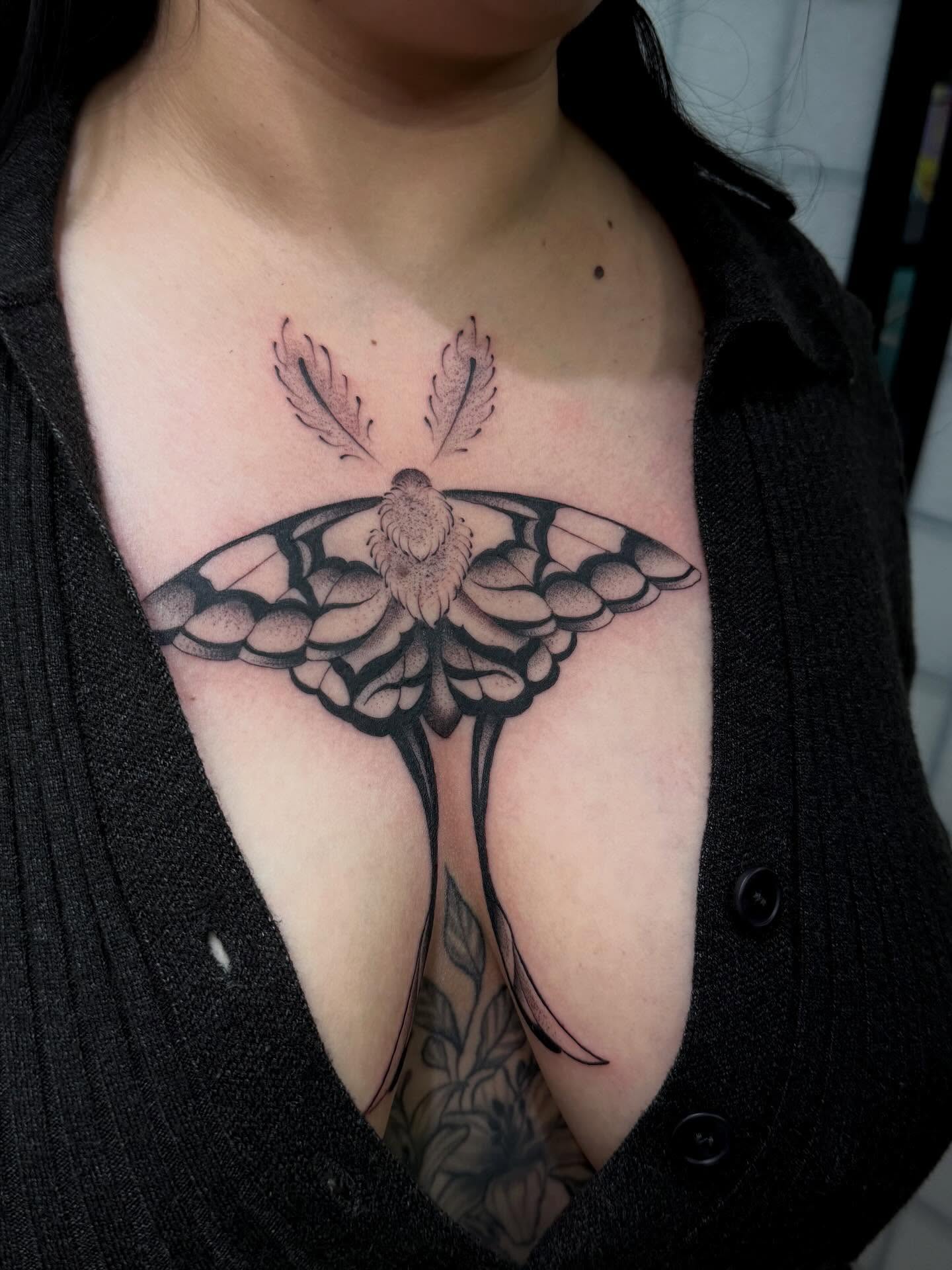 Moth black and grey tattoo on the chest by christian martinez