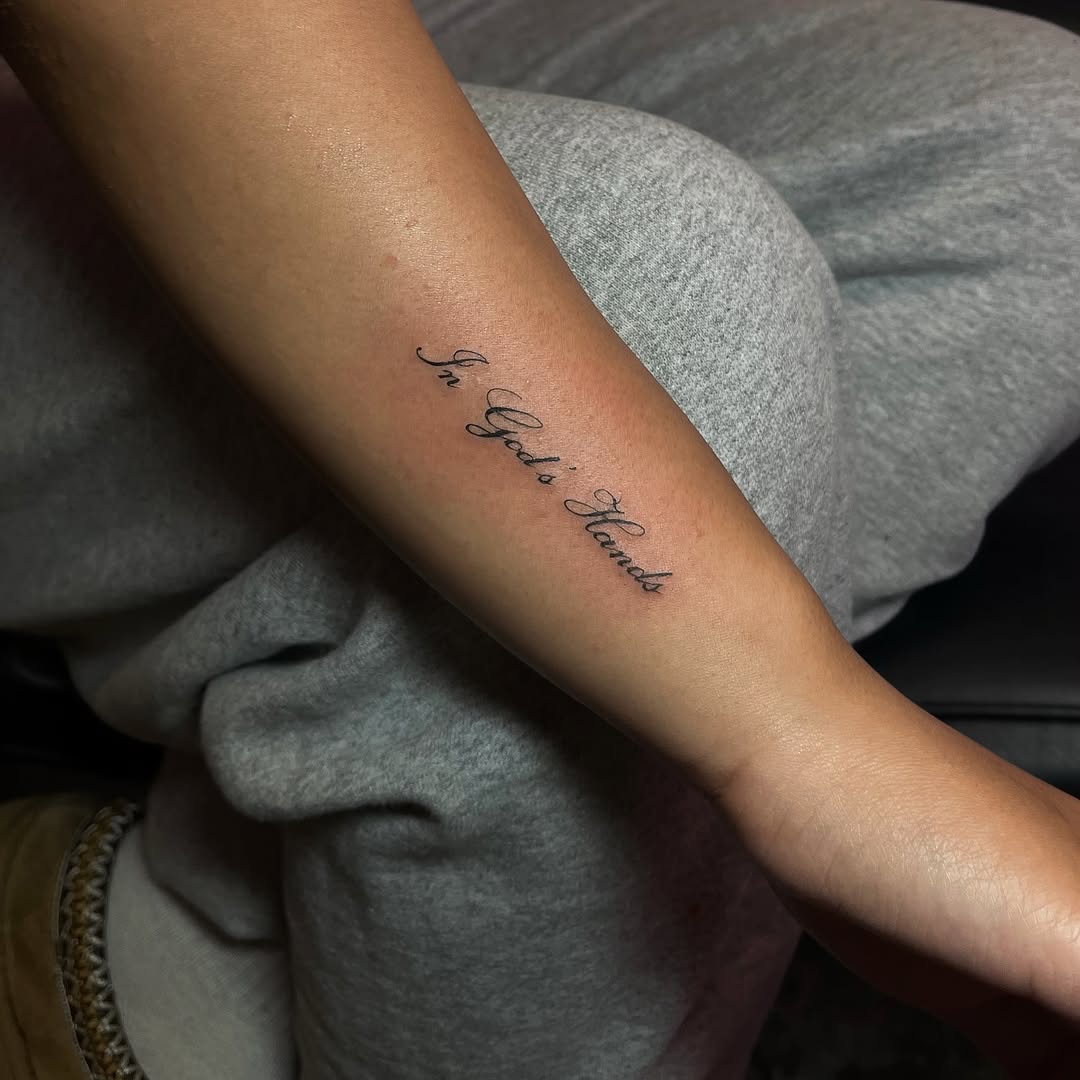 Script lettering lettering tattoo on the forearm by MK