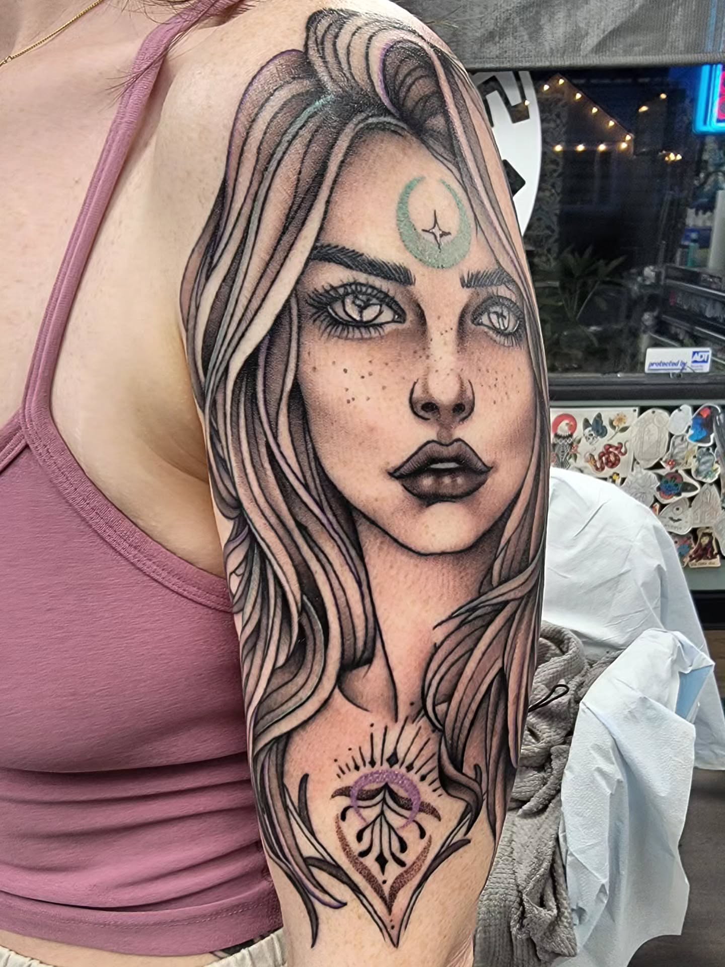 Woman with crescent moon realism tattoo on the forearm by Chantel Chan, Portland, Oregon