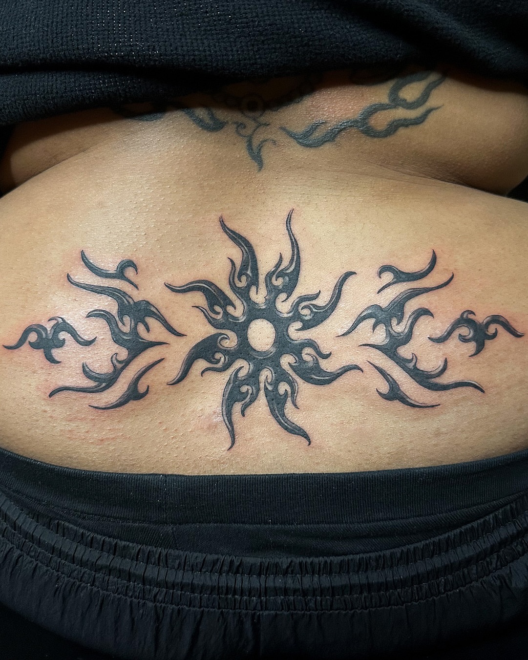 Sunburst tribal tattoo on the back by ๐ฐ ๐ต๐๐๐๐๐ ๐ฐ