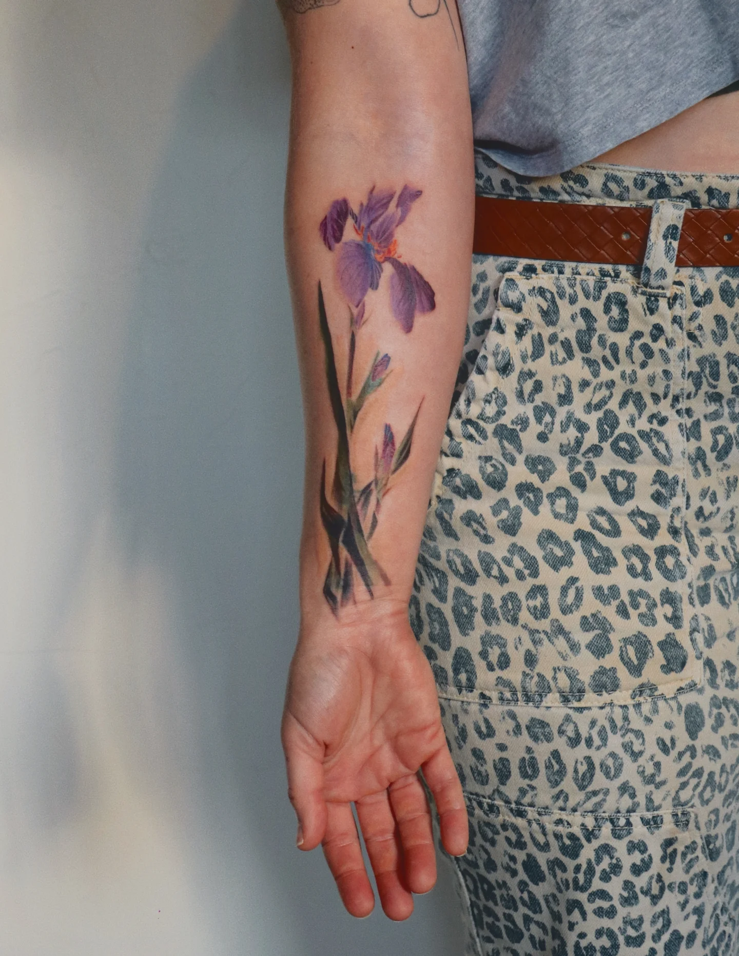Iris watercolor tattoo on the forearm by Jhenn