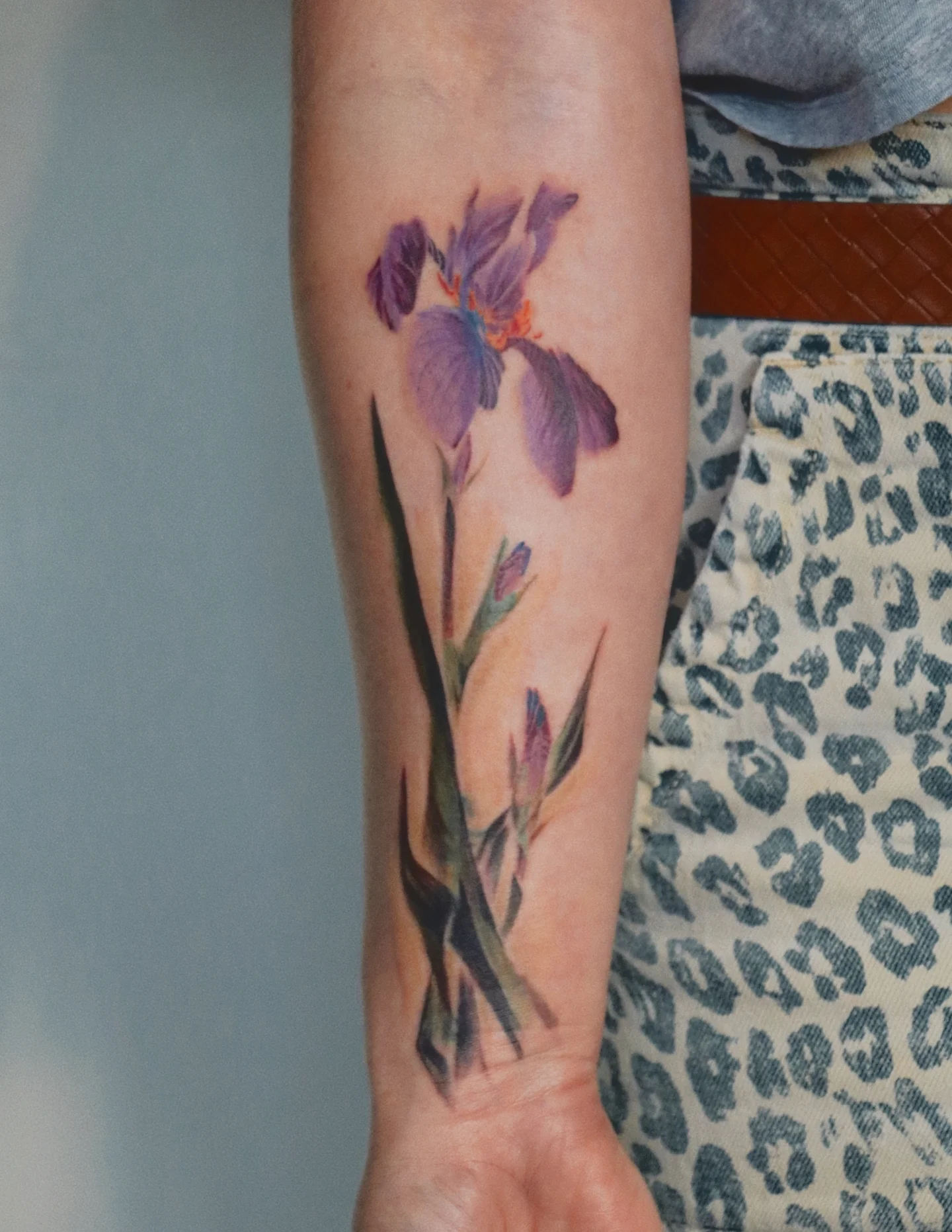 Iris flower watercolor tattoo on the forearm by Jhenn