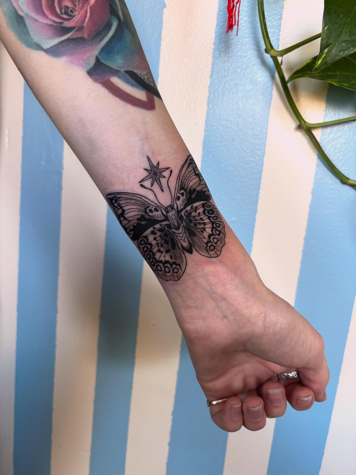 Butterfly black and grey tattoo on the forearm by Ashley Ellerman