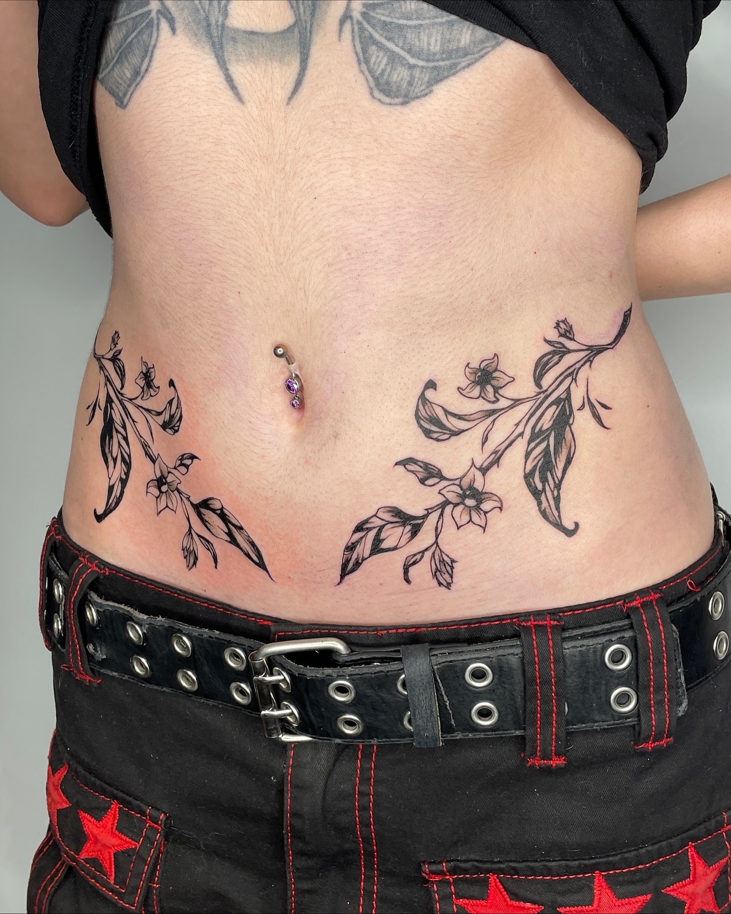 Floral branch black and grey tattoo on the torso by Mia 	\(★ω★)