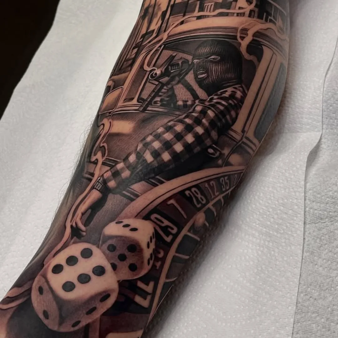 Roulette wheel and dice realism tattoo on the forearm by ink.alchemist