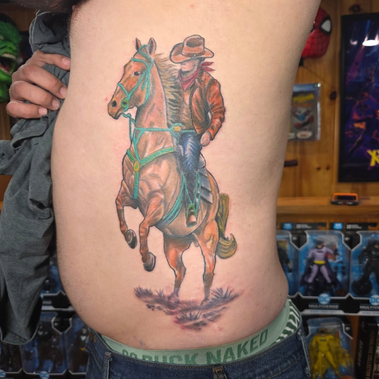 Cowboy on horse realism tattoo on the thigh by Rusty Williams