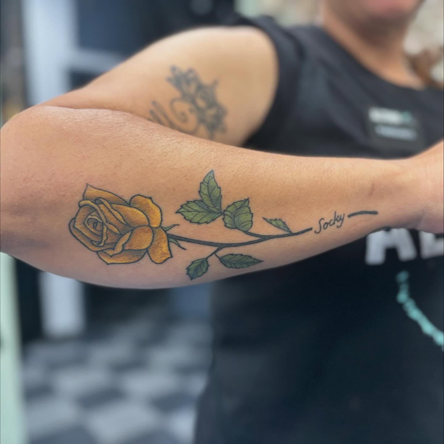 Yellow rose realism tattoo on the forearm by Cam Sykes