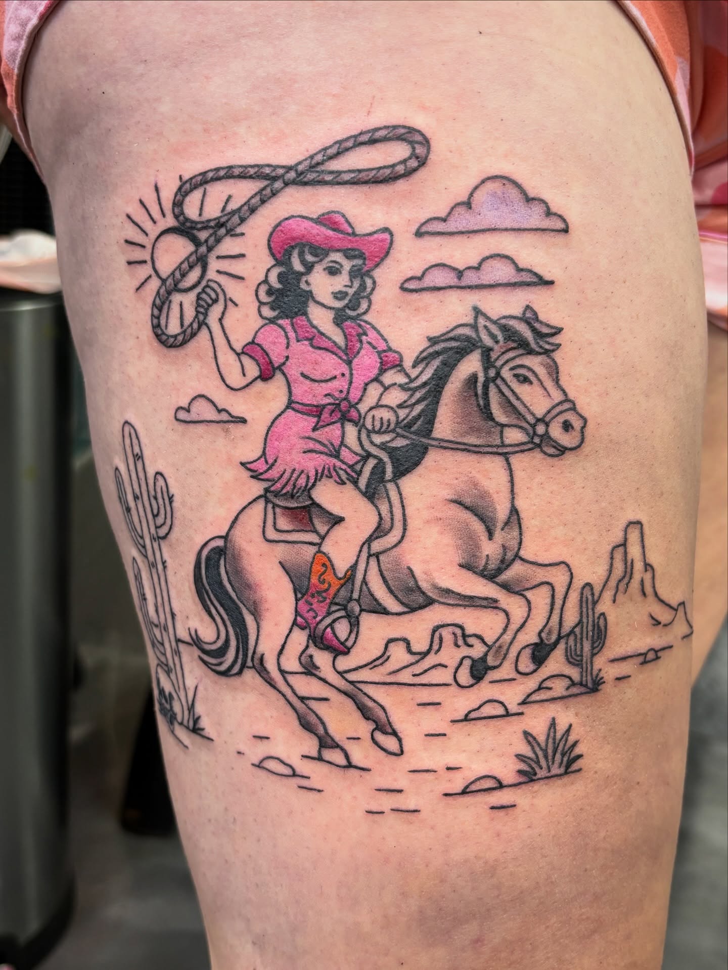 Cowgirl riding horse American traditional tattoo on the thigh by Sara
