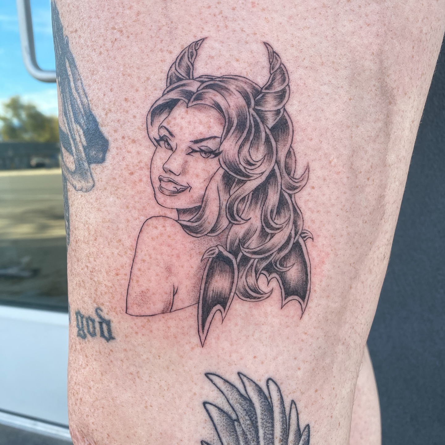Woman with horns black and grey tattoo on the forearm by Mack ๐ Utah Tattoos