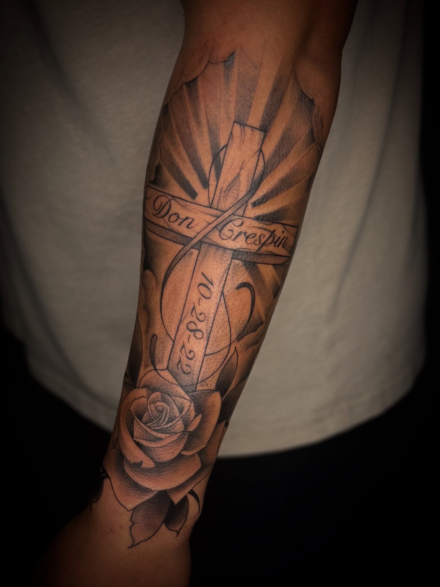 Cross with rose black and grey tattoo on the forearm by Marcus