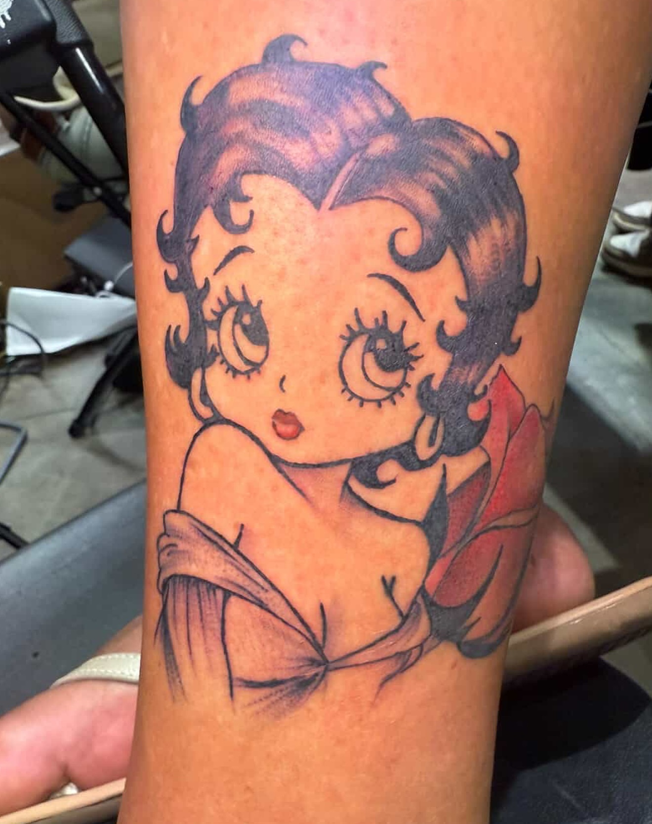 Betty Boop American traditional tattoo on the forearm by Butta