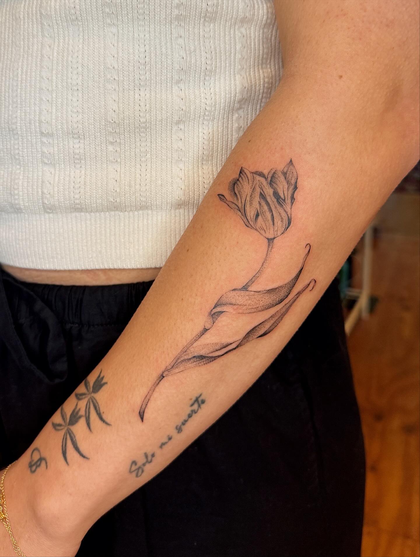 Tulip black and grey tattoo on the forearm by tattoos by miss jackie o 🎱