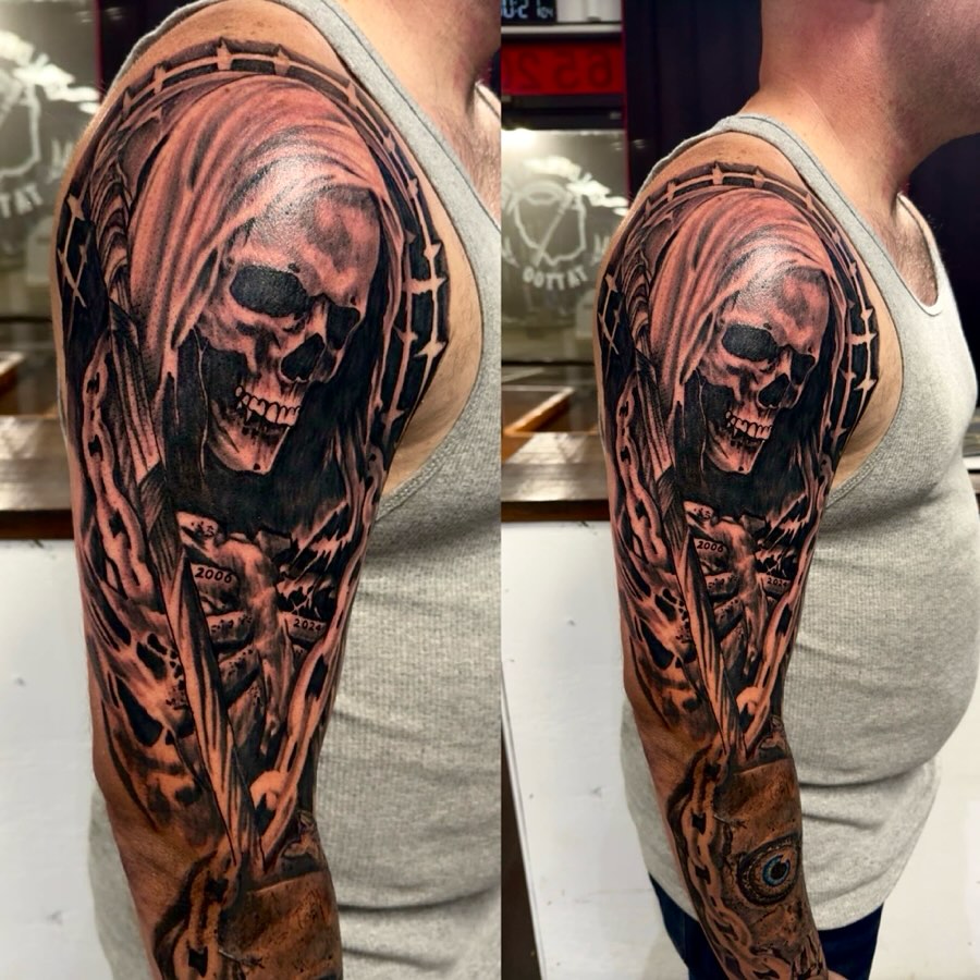 Reaper skull dark realism tattoo on the upper arm by Tattoosbybeanz