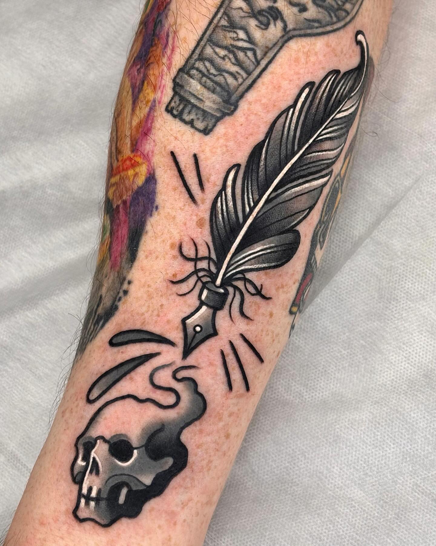 Quill and skull American traditional tattoo on the forearm by 부산타투