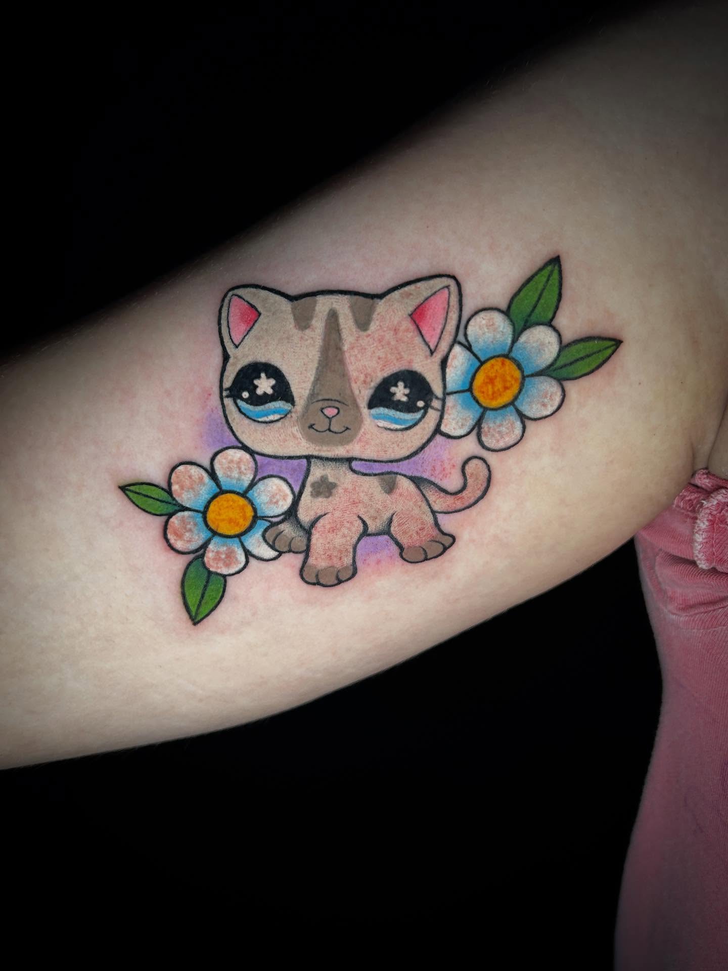 Kitten with flowers new school tattoo on the forearm by ✶ 𝓑𝓲𝓽𝓮𝓼𝓲𝔃𝓮𝓭 𝓘𝓷𝓴 ✶, Buford, Georgia