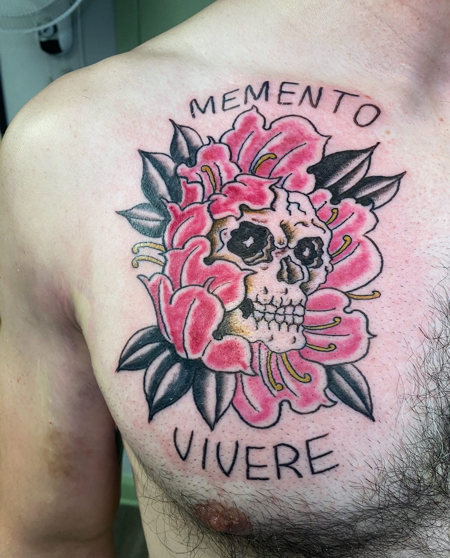Skull and flowers American traditional tattoo on the chest by Giuseppe T.C.