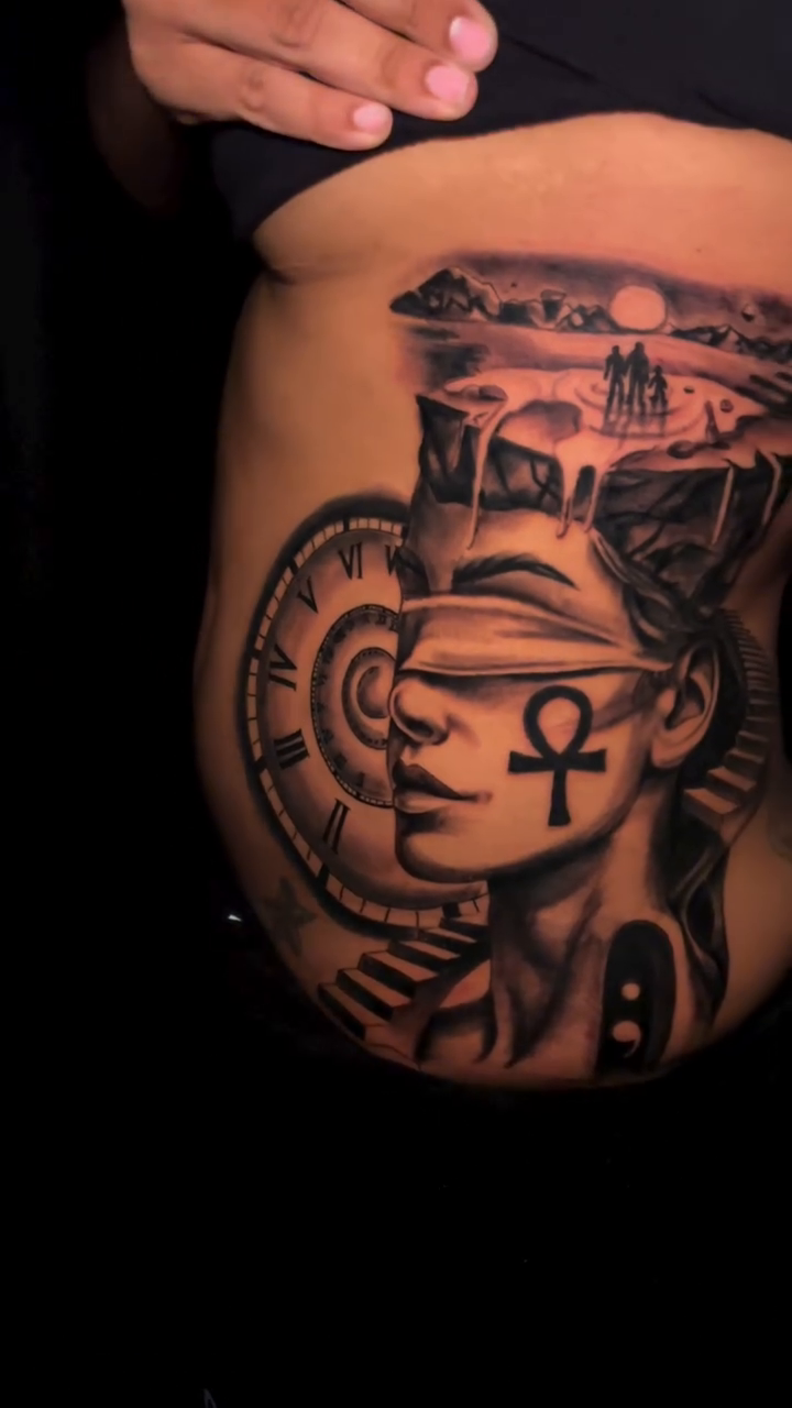 Egyptian goddess with ankh and landscape realism tattoo by Lucky Lefty