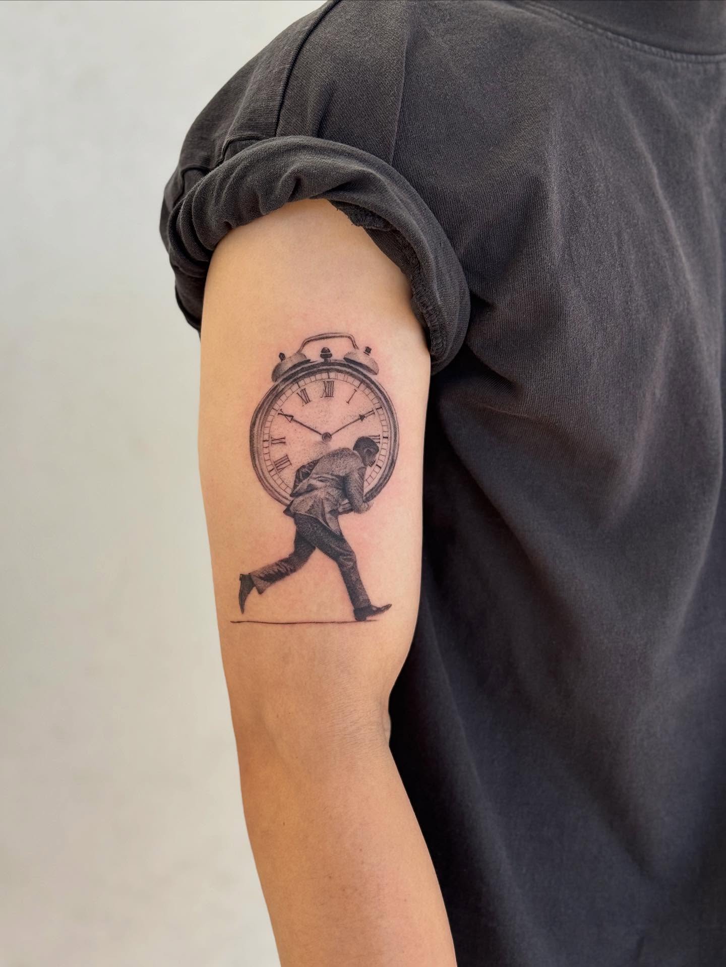 Man running with clock realism tattoo on the forearm by Karina ⋆⭒˚.⋆