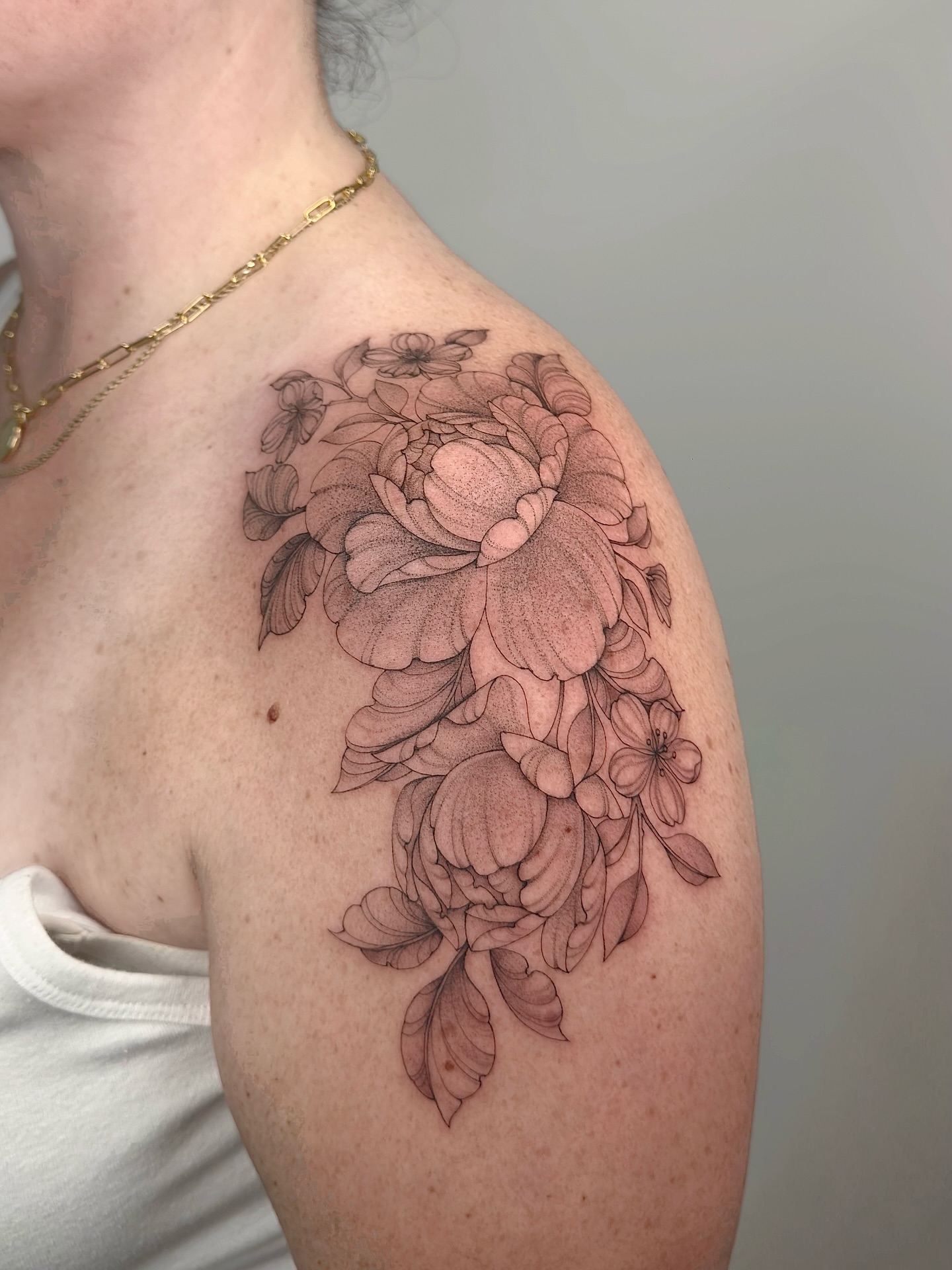 Floral arrangement black and grey tattoo on the shoulder by MillaKas ° Tattoos