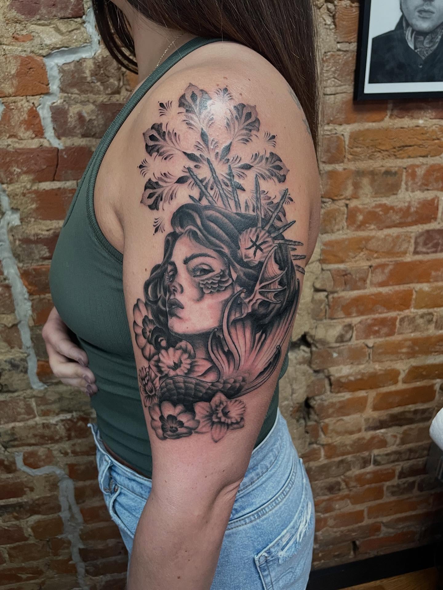 Woman with floral crown realism tattoo on the shoulder by Auzzy the Ink Pirate, Mansfield, Ohio