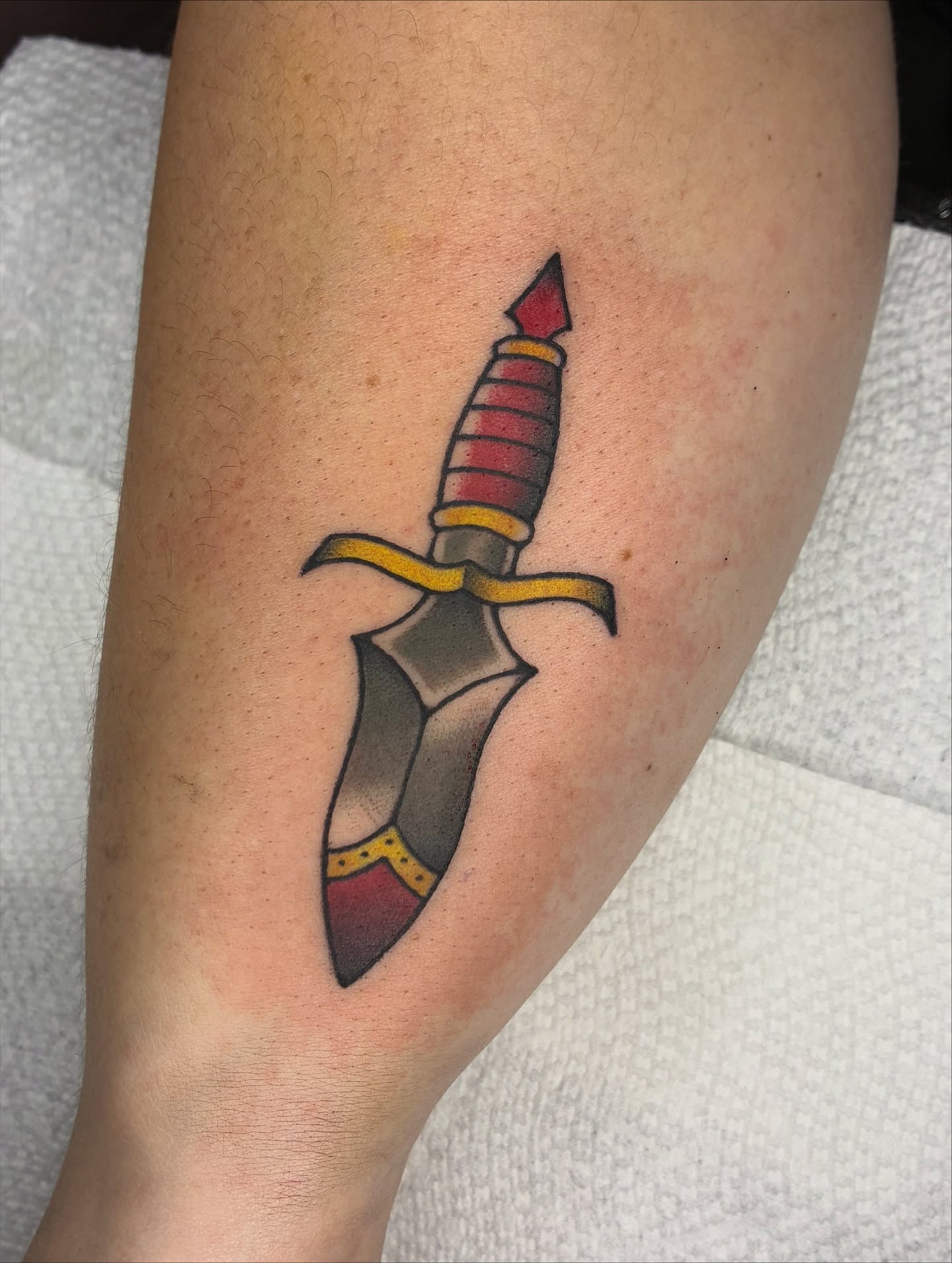 Dagger American traditional tattoo on the forearm by Lance 🦈