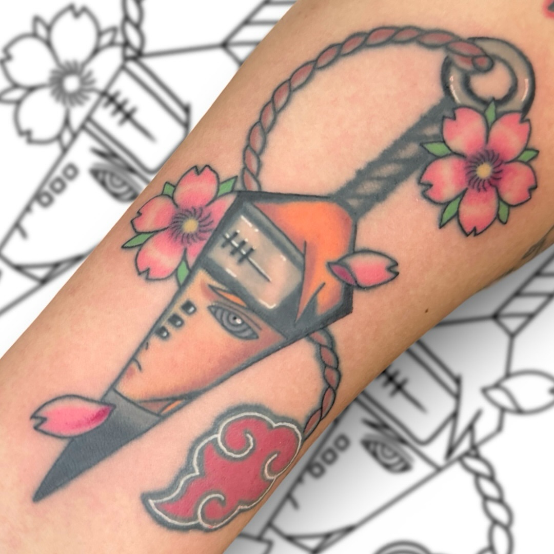 Anime character with sakura blossoms anime tattoo on the forearm by Victor Campos