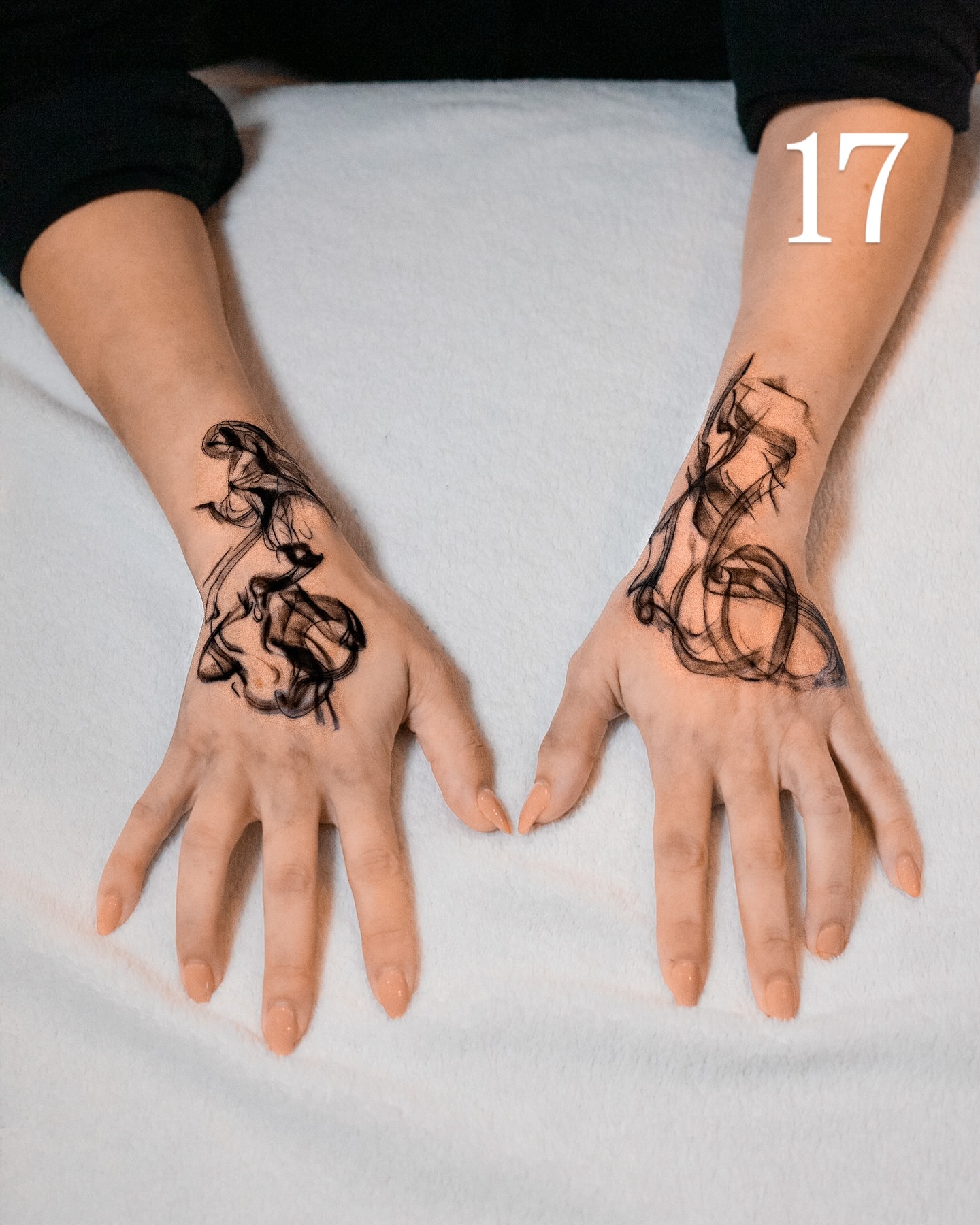 Abstract swirls black and grey tattoo on the hand by The Tattoo Plug
