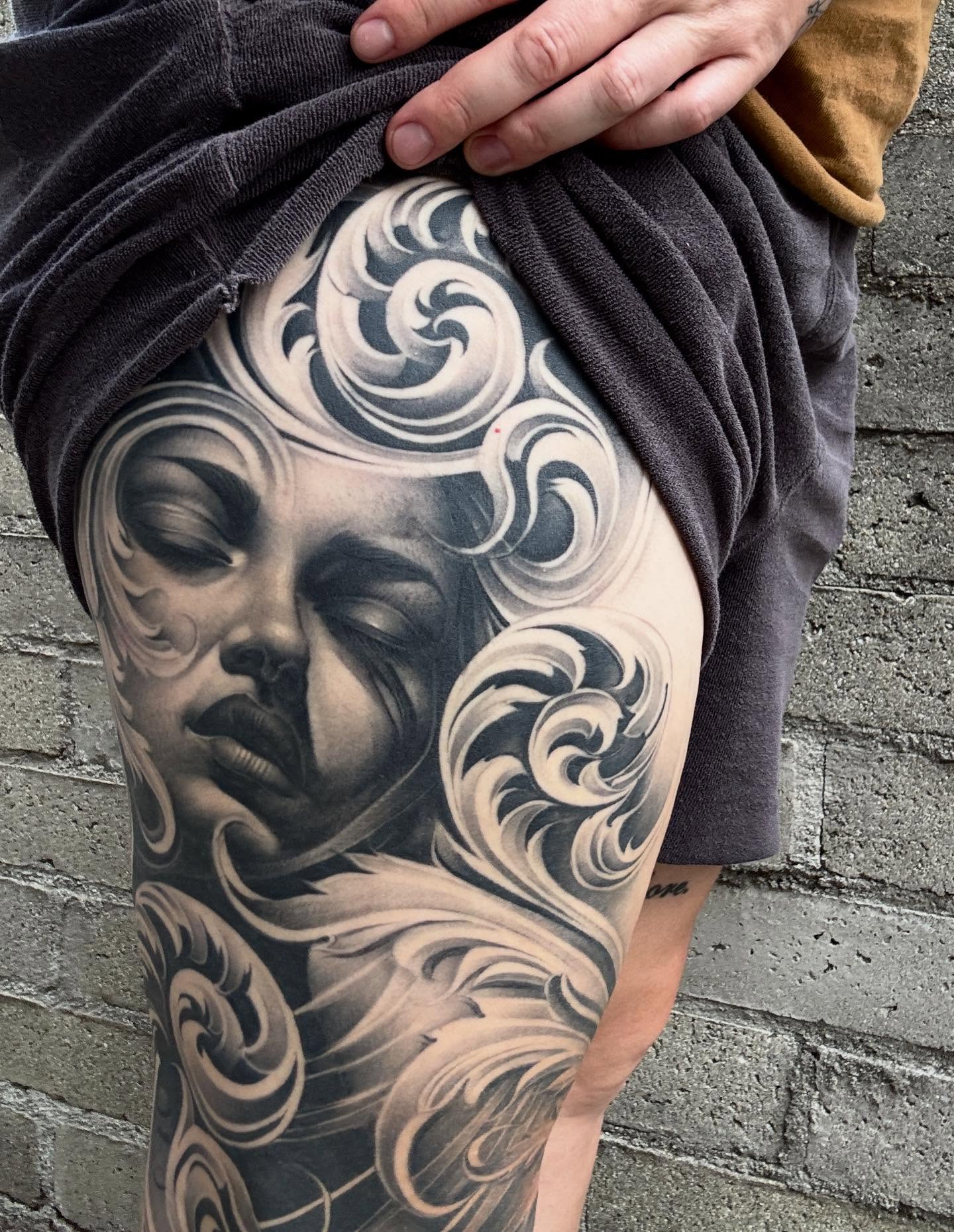 Woman's face realism tattoo on the thigh by Jayjay🦅