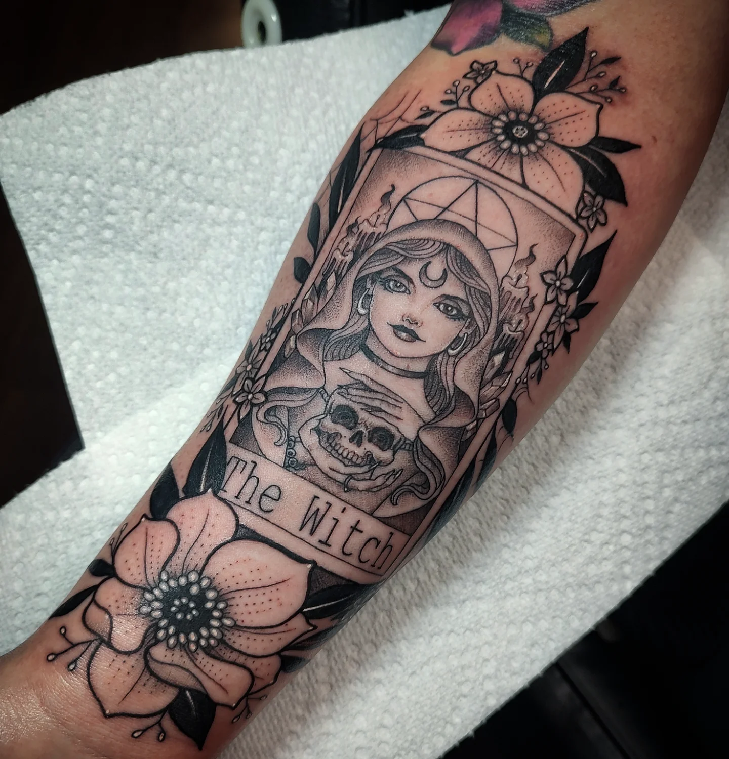 Witch American traditional tattoo on the forearm by Jennifer Fowler