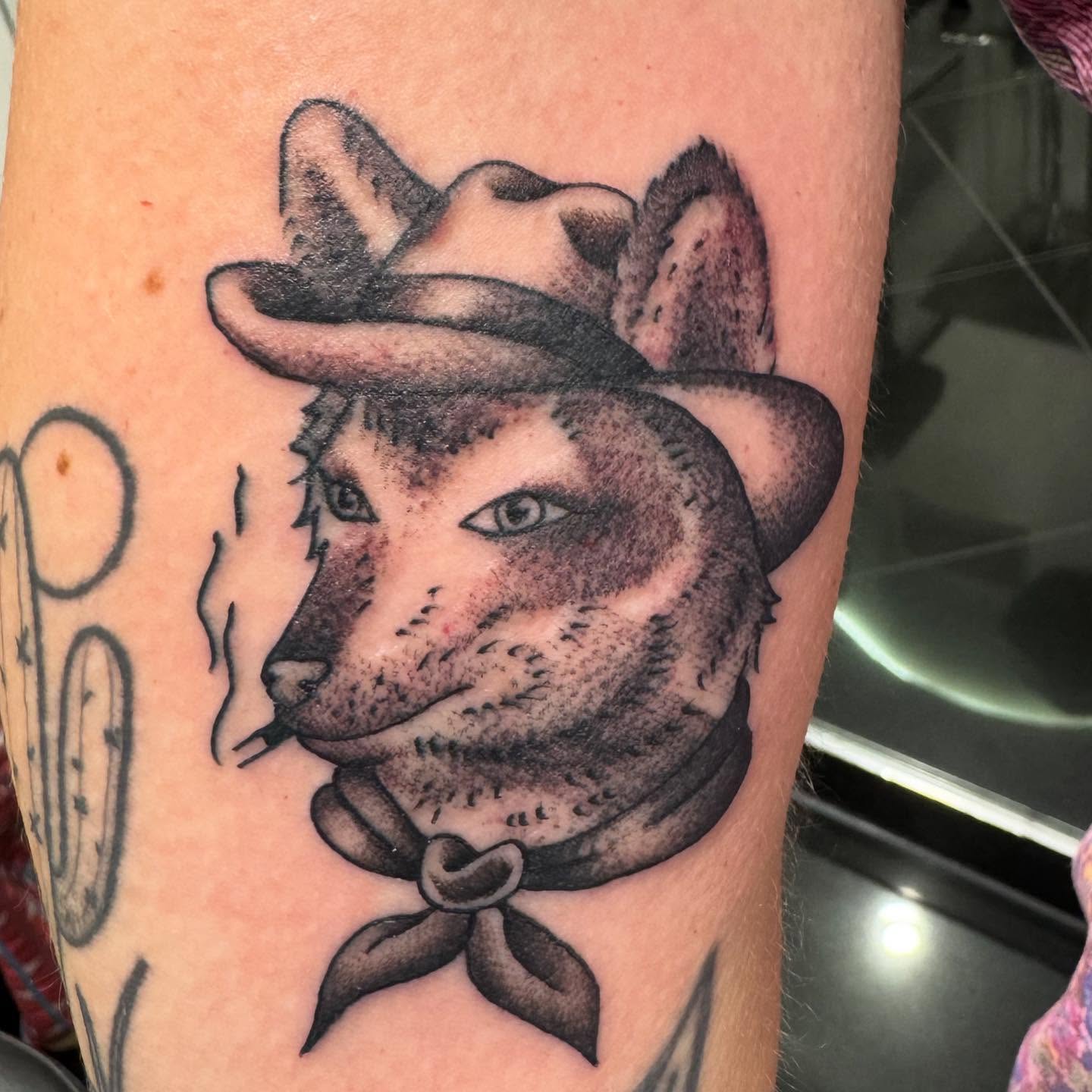 Cat wearing cowboy hat realism tattoo on the forearm by Brian Herrera