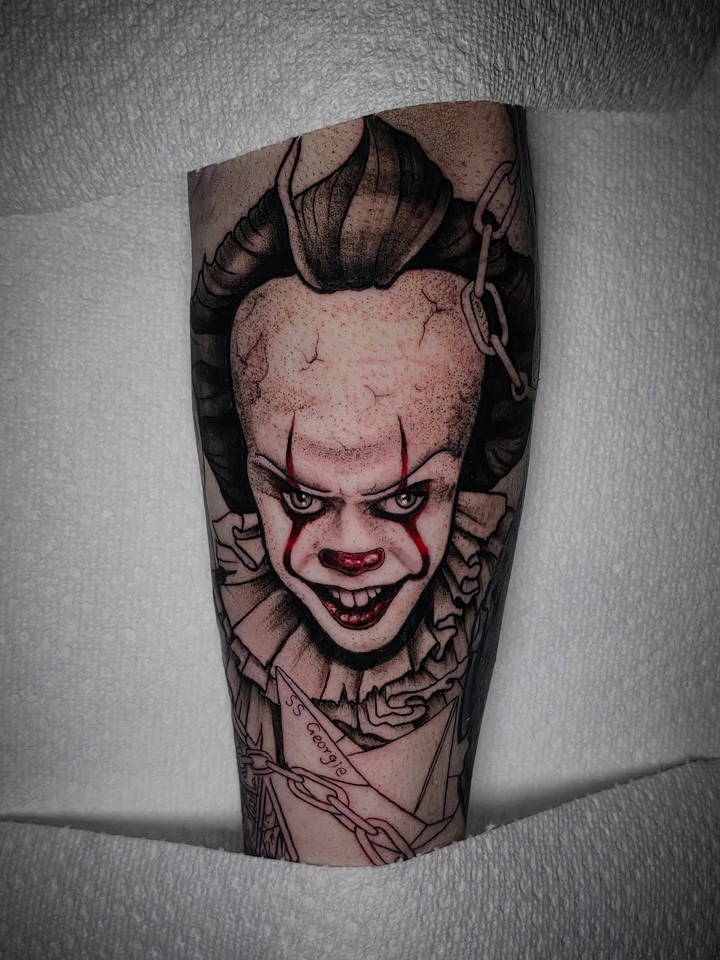 Pennywise realism tattoo on the calf by Kelsey Lorrae, Ankeny, Iowa