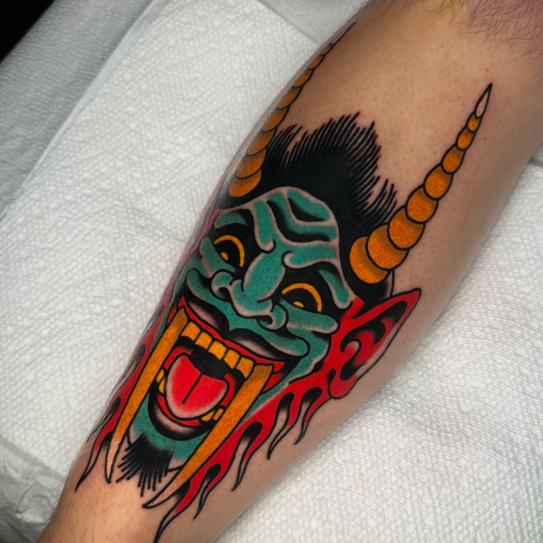 Demon mask American traditional tattoo on the forearm by Schyler Ames, Canal Fulton, Ohio