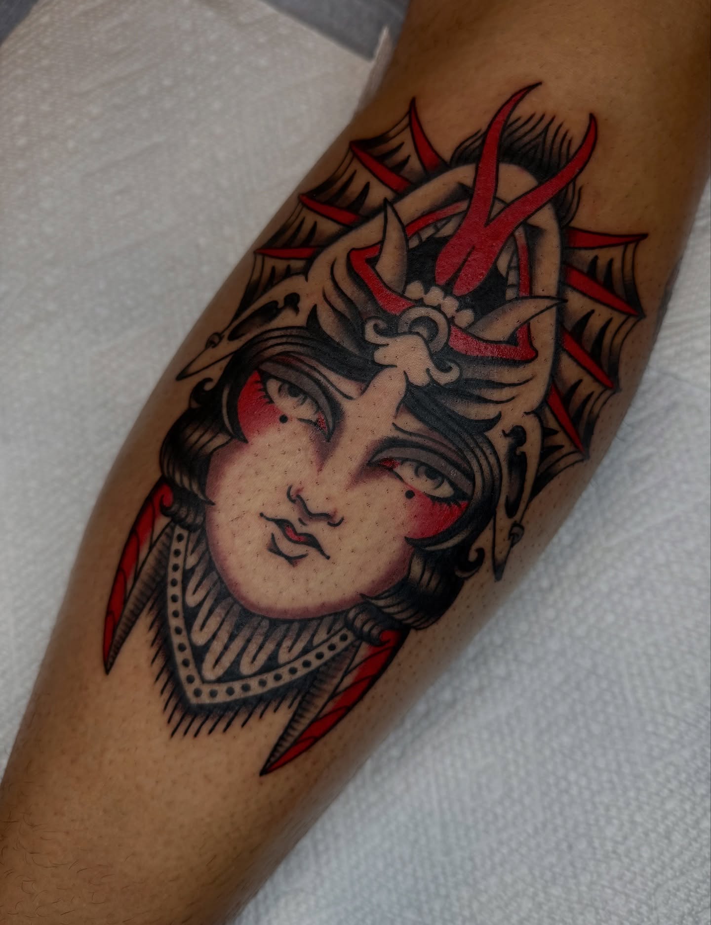 Woman's face American traditional tattoo on the forearm by kate