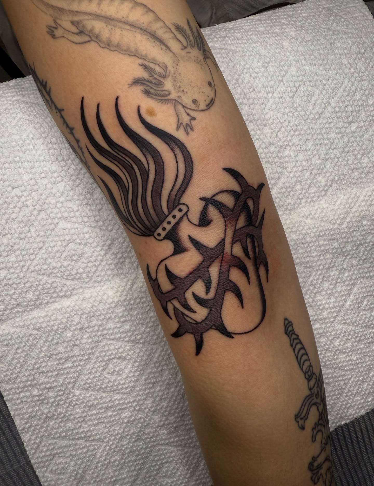 Tribal flame tribal tattoo on the forearm by kate