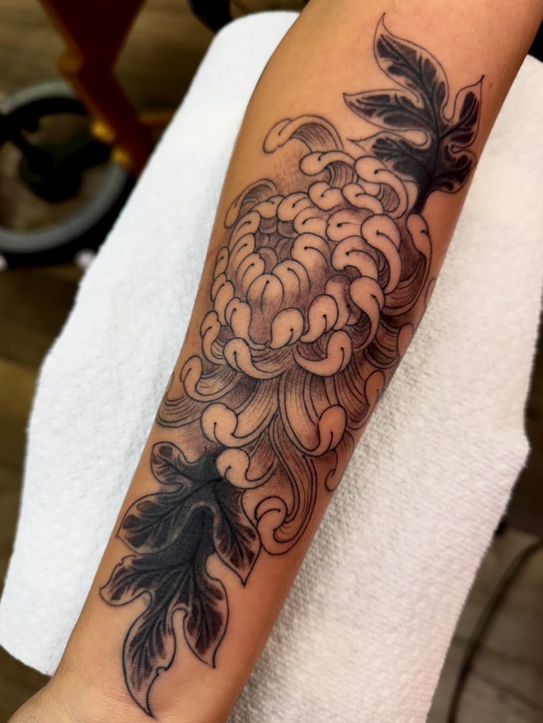 Pineapple black and grey tattoo on the forearm by Chris Orta
