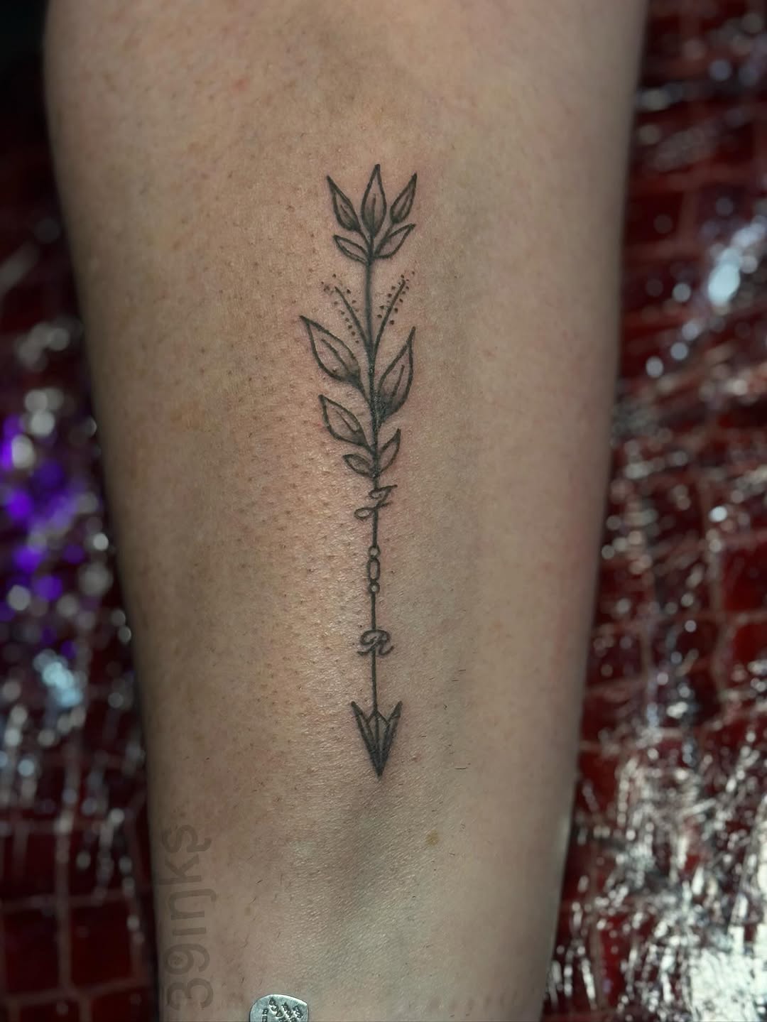 Arrow with leaves and lettering tattoo on the forearm by Juliette :D