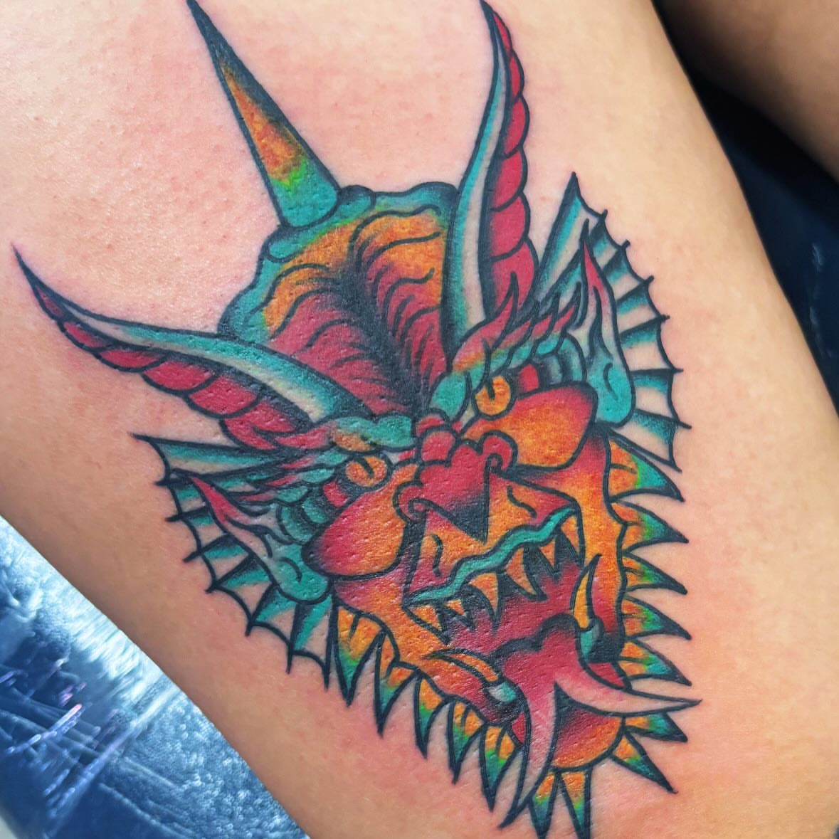 Dragon American traditional tattoo on the thigh by 18 and older High End Tattoo