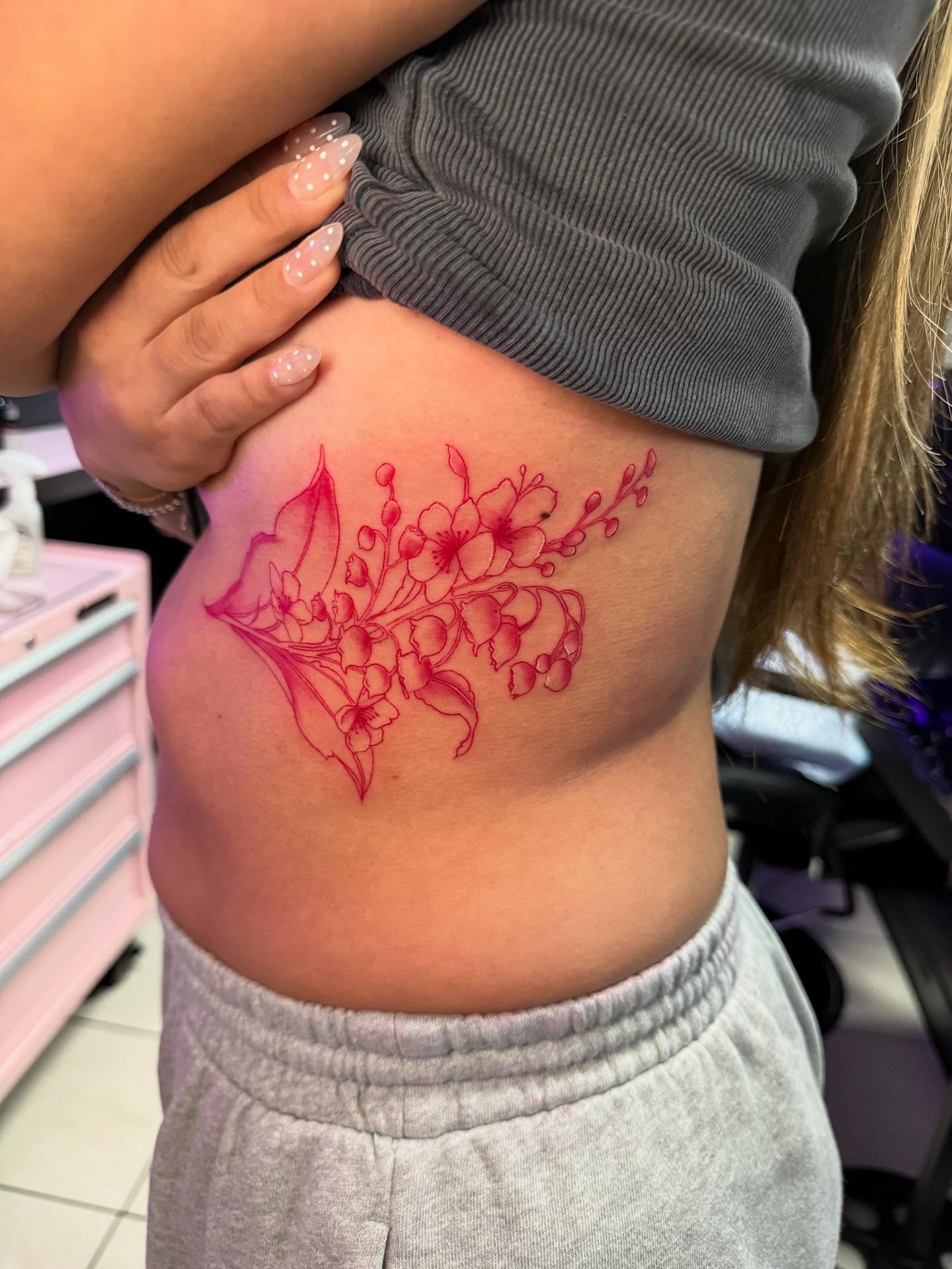 Floral arrangement dotwork tattoo on the ribs by Jasmin Lozano