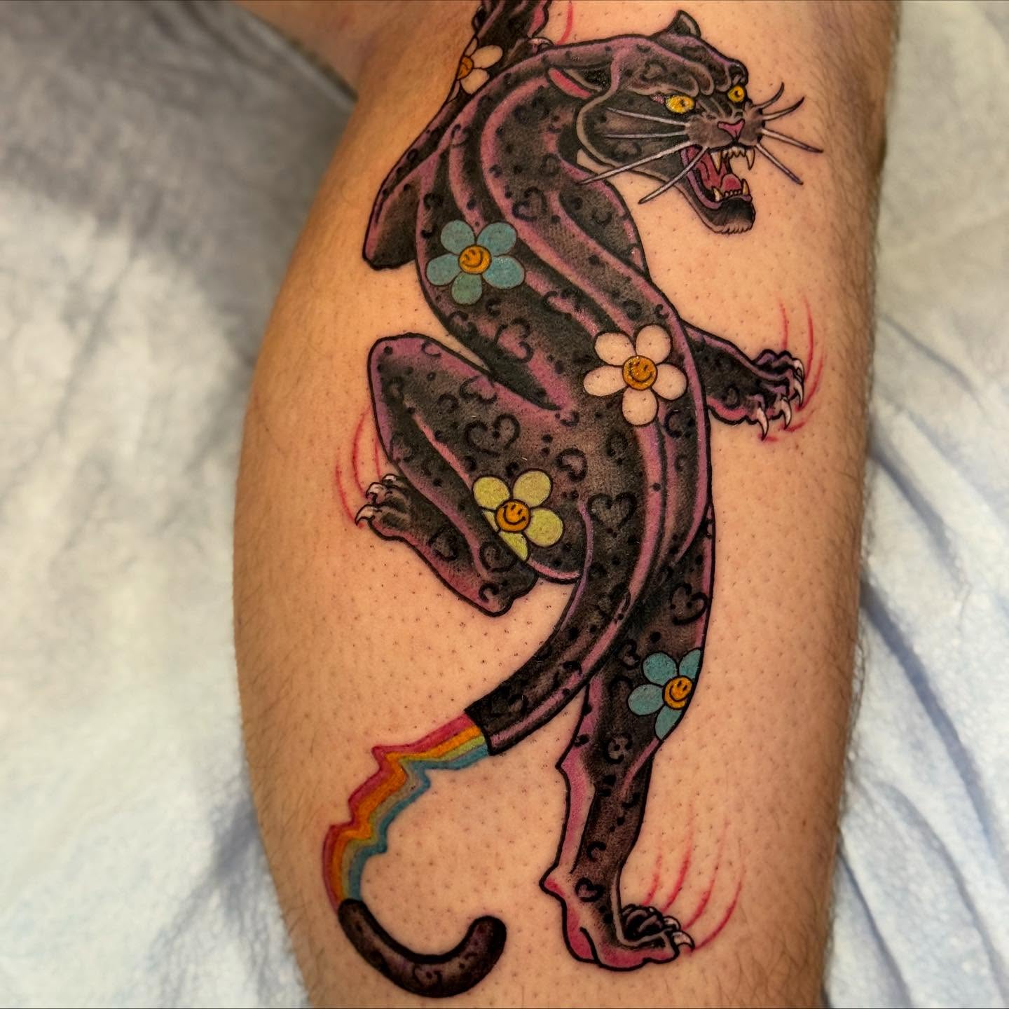 Panther with flowers American traditional tattoo on the forearm by English Cousins, Nashville, Tennessee