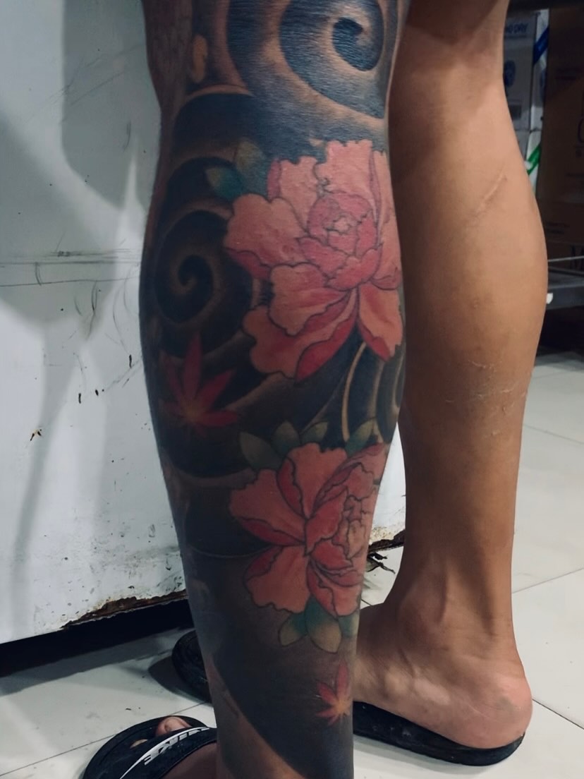 Peony and maple leaves japanese irezumi tattoo on the calf by Gerd thINK_TATTOO