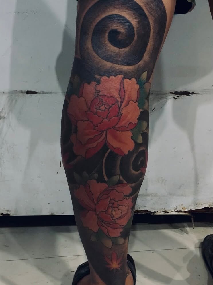 Peony flowers American traditional tattoo on the calf by Gerd thINK_TATTOO