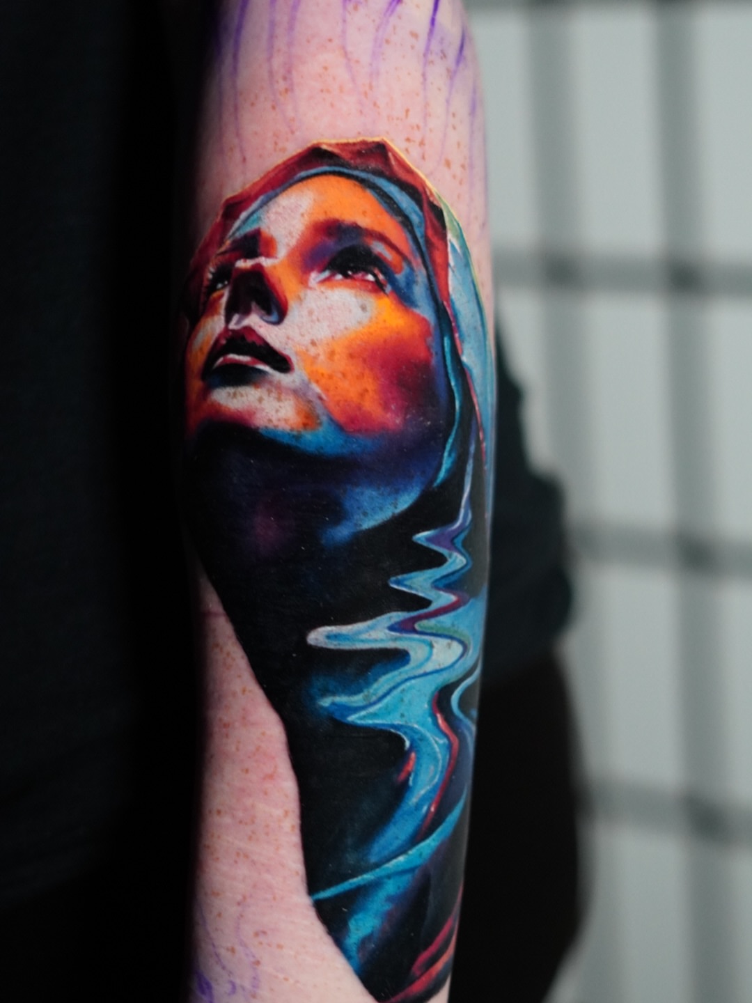 Abstract woman realism tattoo on the forearm by Justin Shelpman